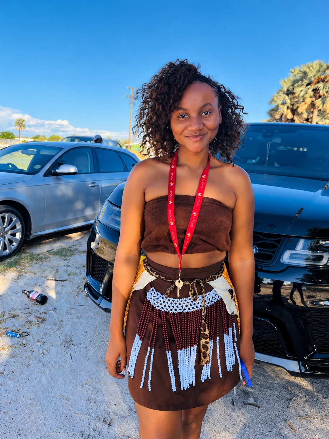 Portrait in beaded clothing outdoors